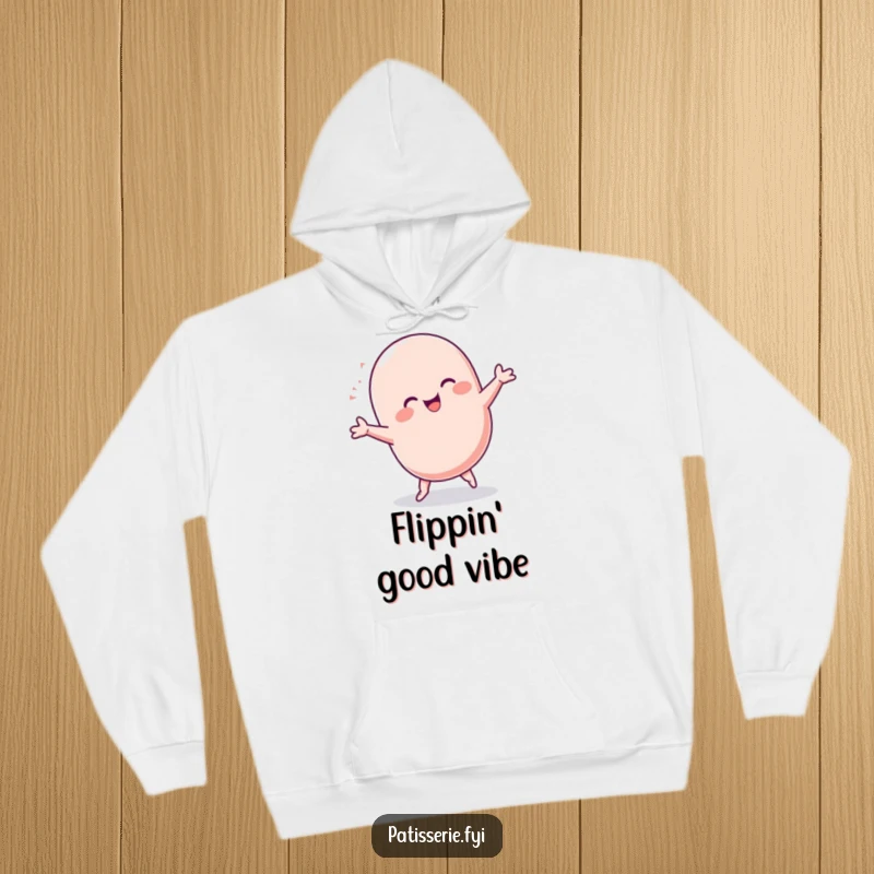 Funny Macaron Hoodie: A chubby, ecstatic macaron character doing a celebratory cartwheel, embodying vibrant energy and sweet, baked joy.