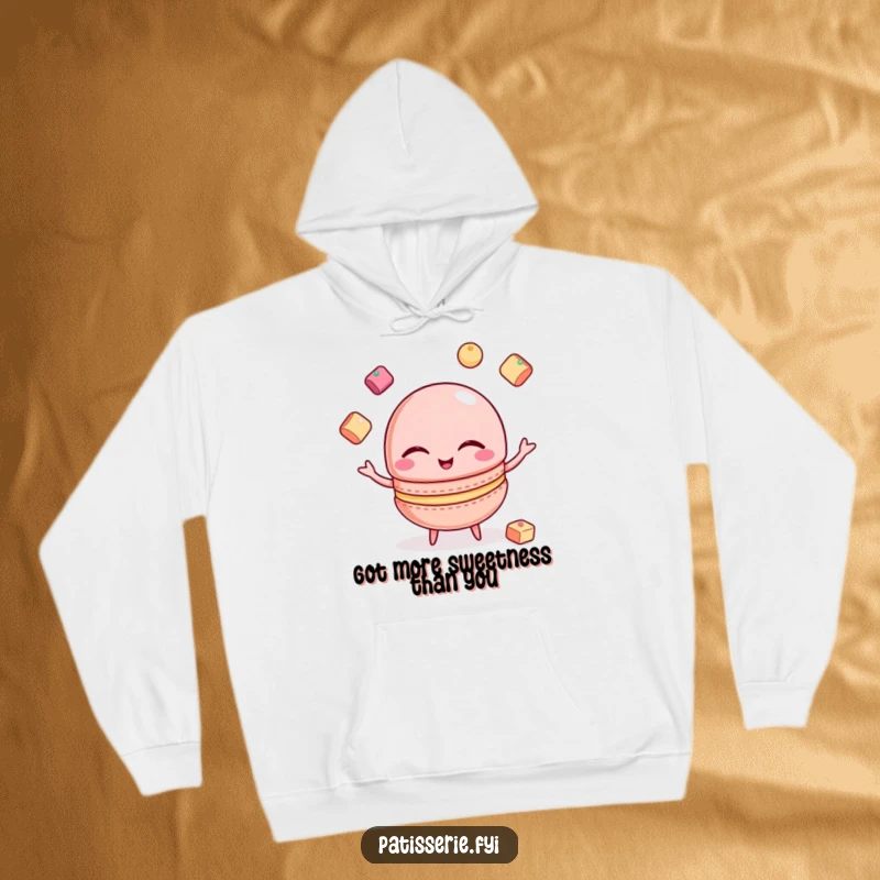 Funny Macaron Hoodie: A winking macaron juggles sugar cubes, providing warm and funny comfort.