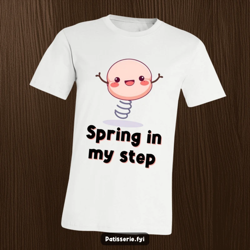 Funny t-shirt depicting a lively macaron bouncing high on a spring, radiating infectious, happy energy.